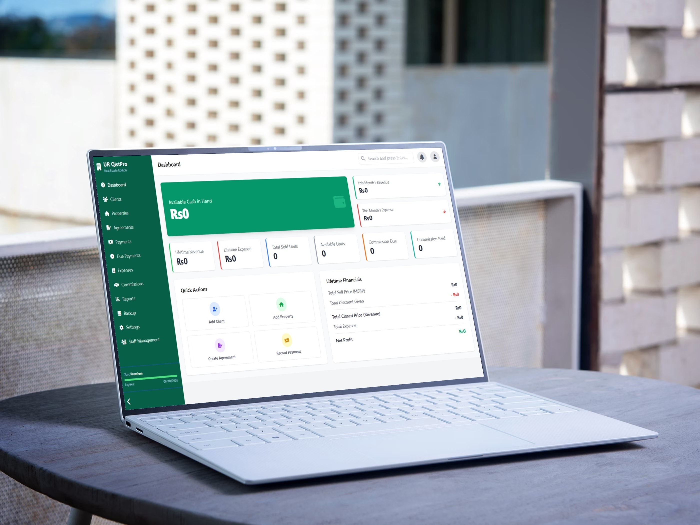 UR QistPro Real Estate Dashboard on a laptop